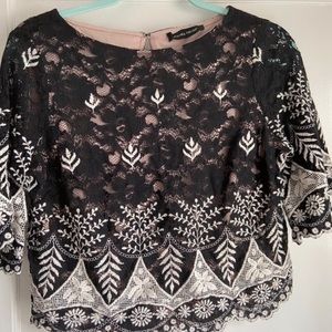 Very nice top for going out length stops at waist